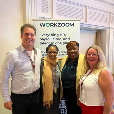 Workzoom team and attendees at the THRIVE 2025 booth in Nassau