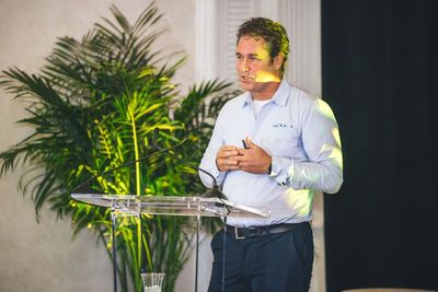 Andy Woolley speaking at THRIVE 2025 in Nassau